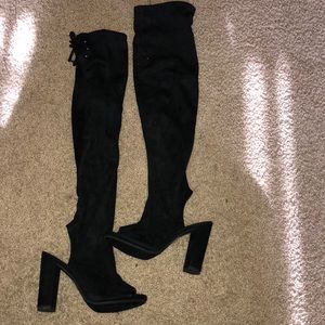 Thigh high heel boots.